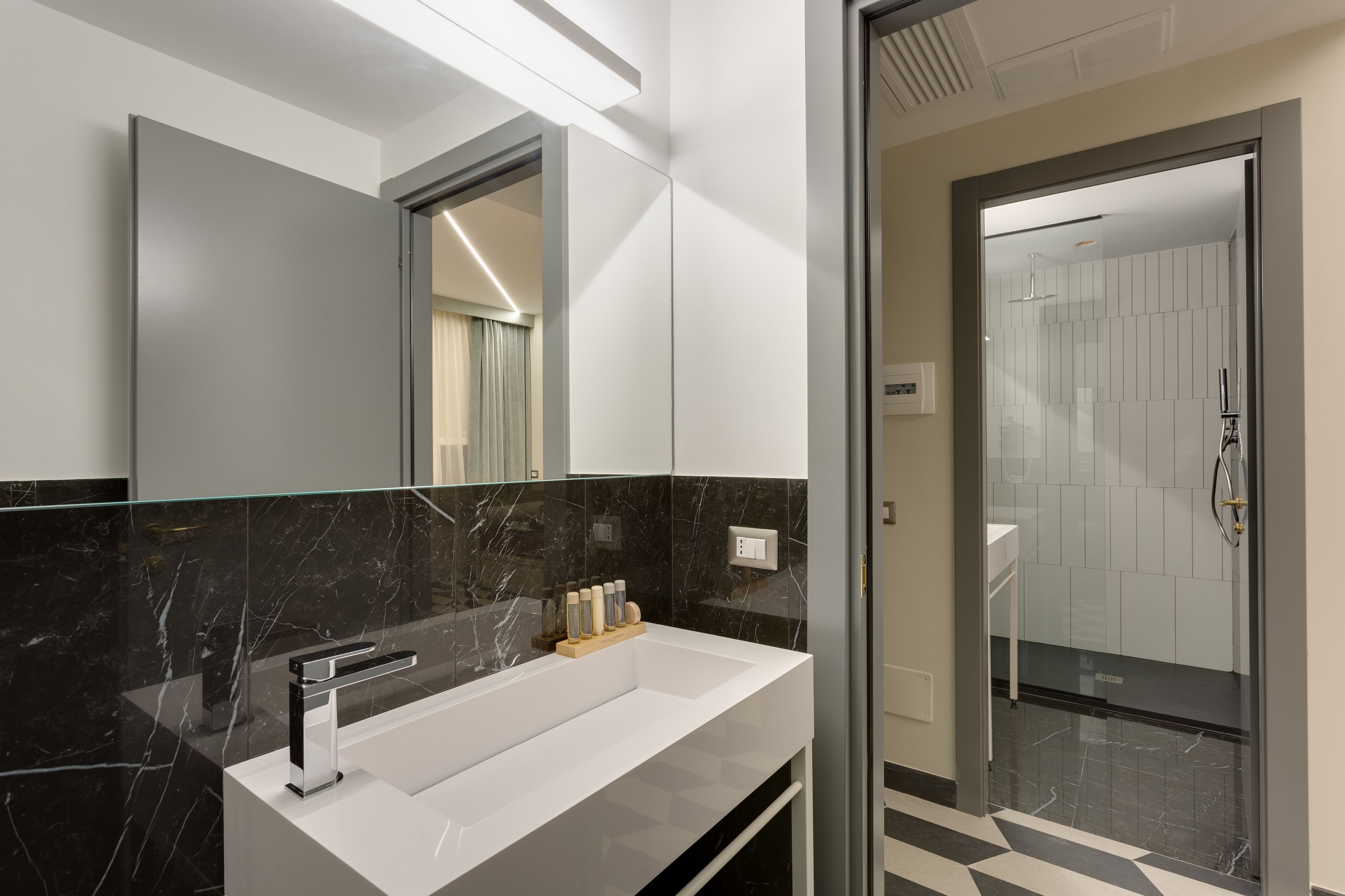 standard quadruple room | bathroom | shower, free toiletries, hair dryer, slippers