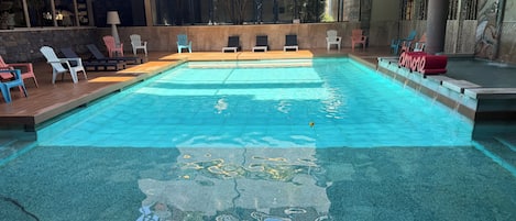 Seasonal outdoor pool, open 9:30 AM to 7:30 PM, pool loungers