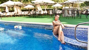 2 indoor pools, outdoor pool, open 9:00 AM to 8:00 PM, pool umbrellas