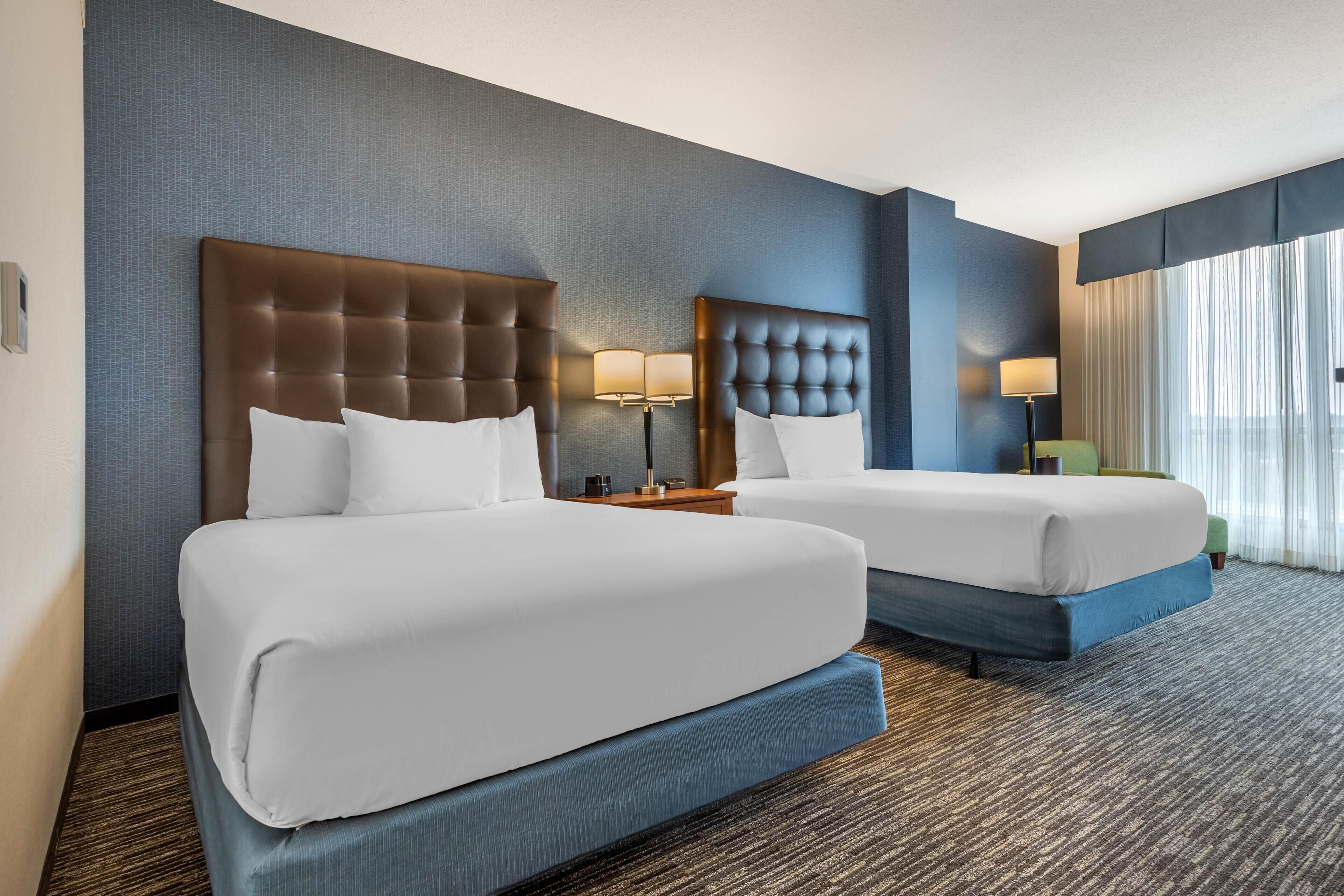 Desk, laptop workspace, blackout drapes, iron/ironing board