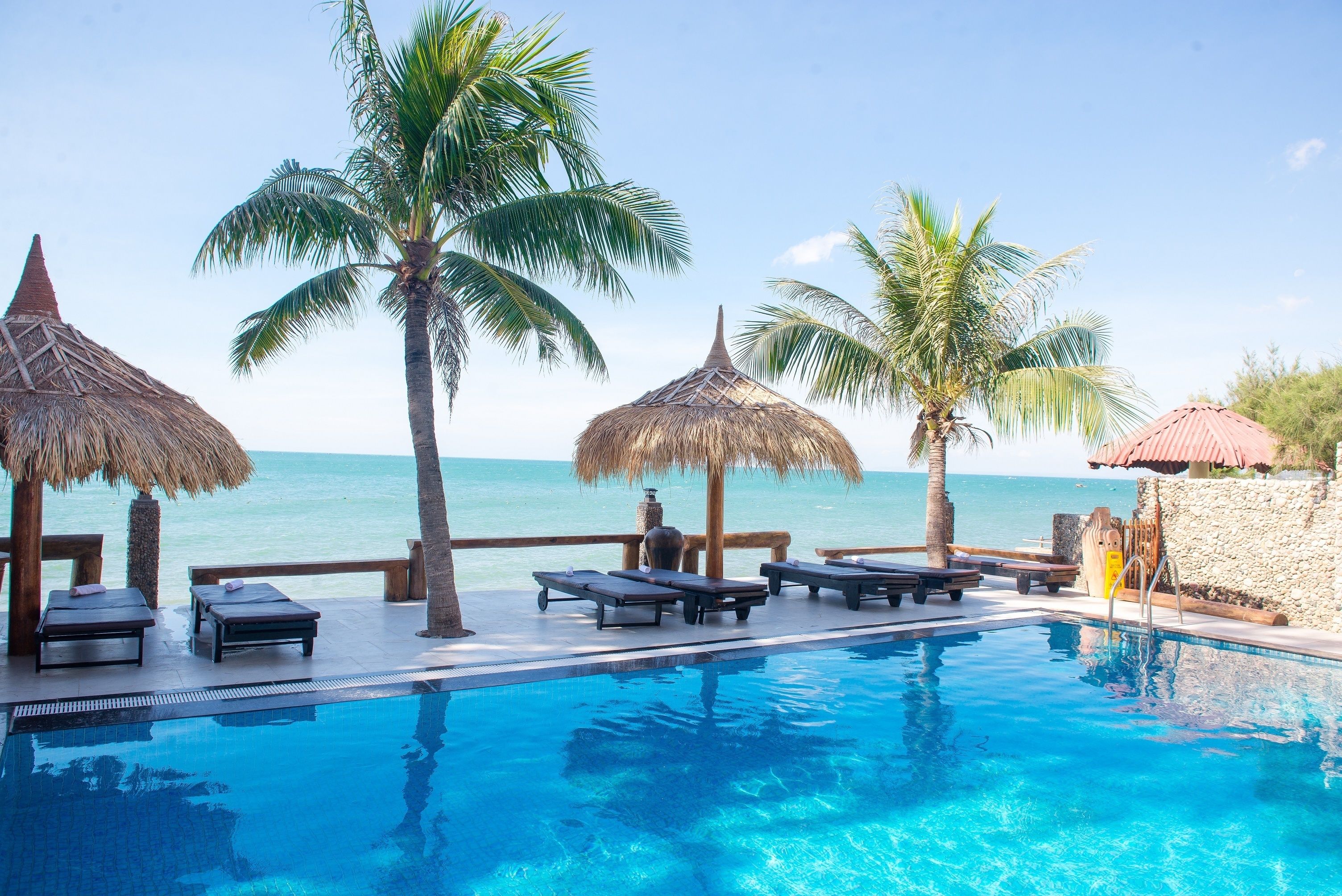 Outdoor pool, open 6:00 AM to 10:00 PM, pool umbrellas