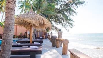 Outdoor pool, open 6:00 AM to 10:00 PM, pool umbrellas