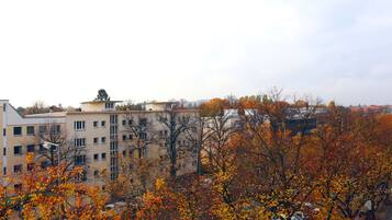 A multi-story building with a flat roof and a central courtyard.