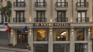 A hotel with a modern facade, multiple balconies with ornate railings, and a prominent sign reading "VIORE HOTEL". - Viore Hotel (Istanbul)
