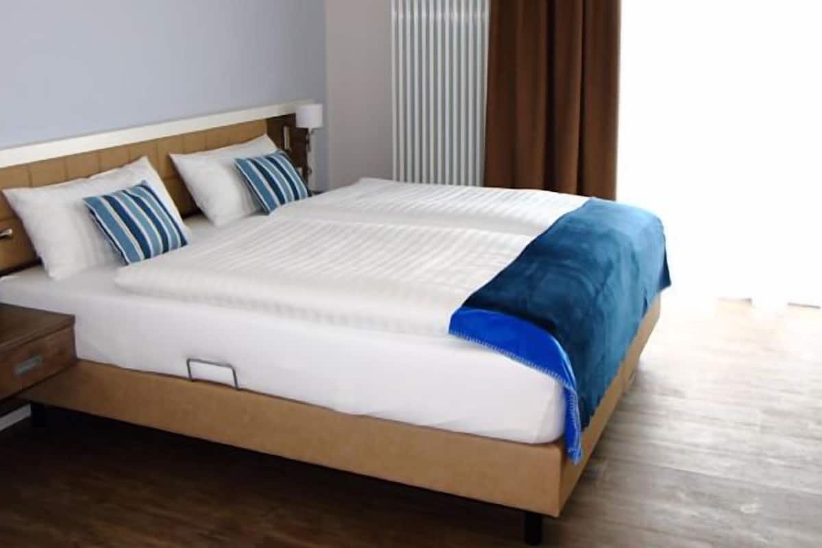 double room, balcony, garden view | in-room safe, desk, soundproofing, free cots/infant beds