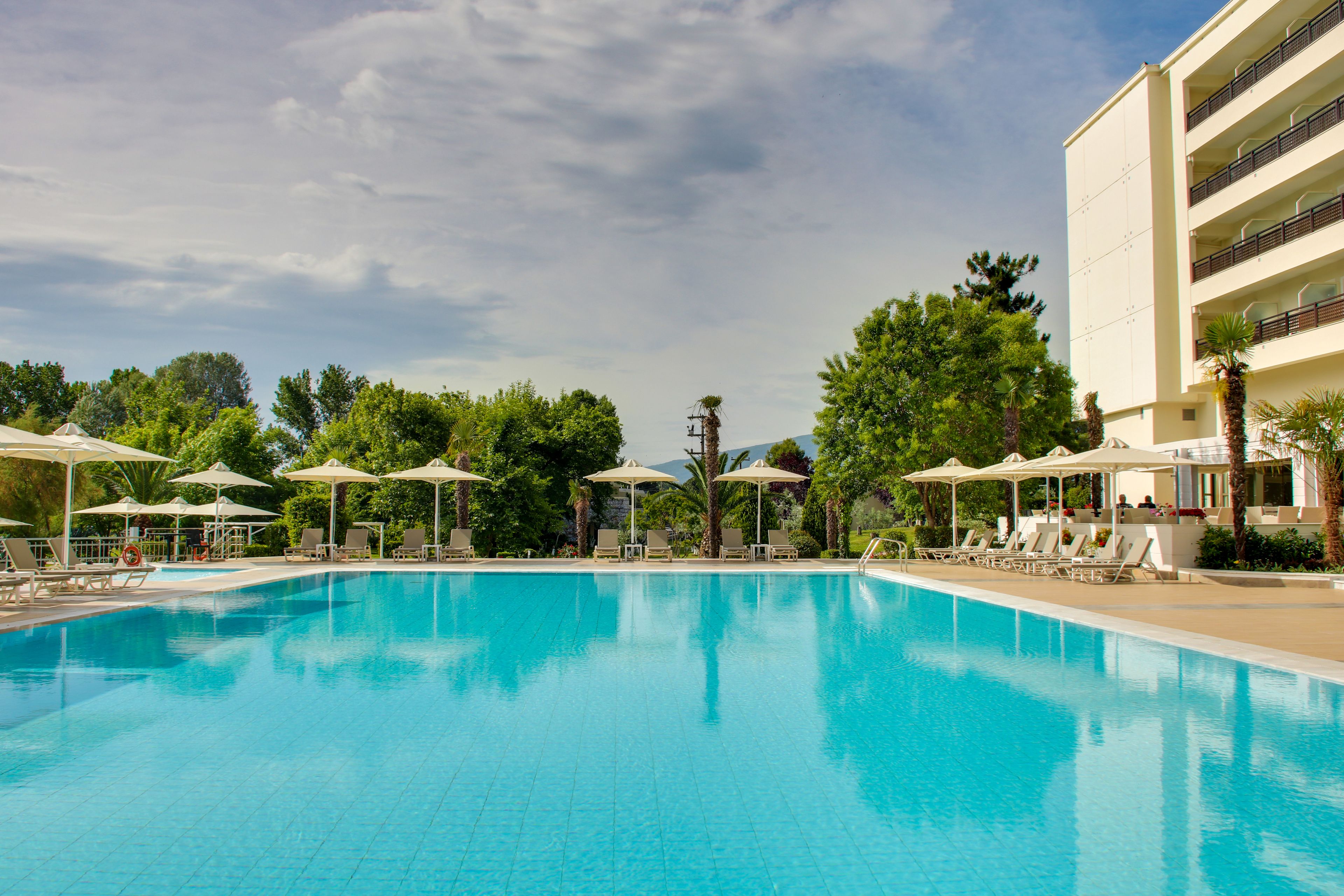 Outdoor pool, pool umbrellas, sun loungers