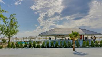 On the beach, sun-loungers, beach umbrellas, beach towels