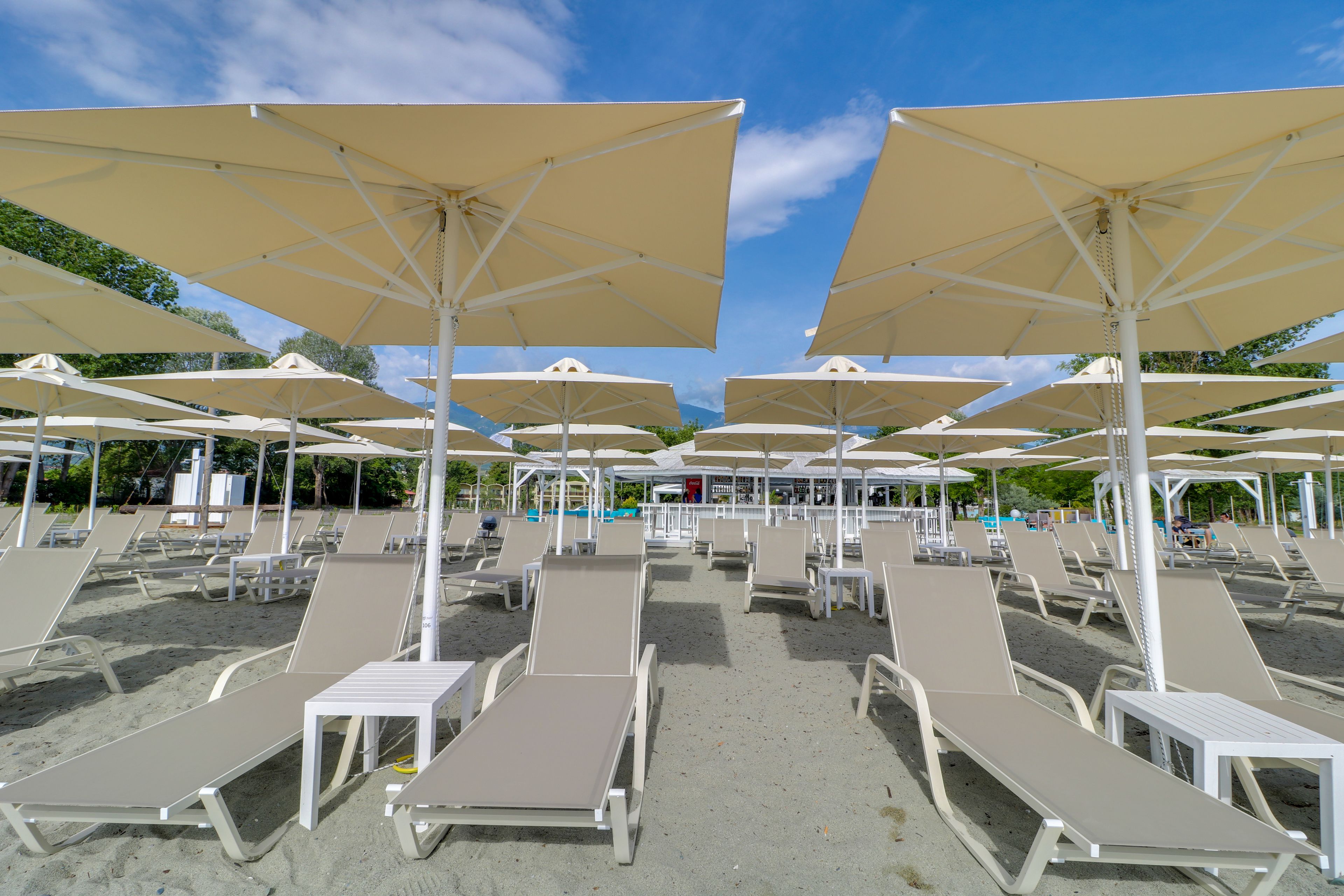 On the beach, sun-loungers, beach umbrellas, beach towels