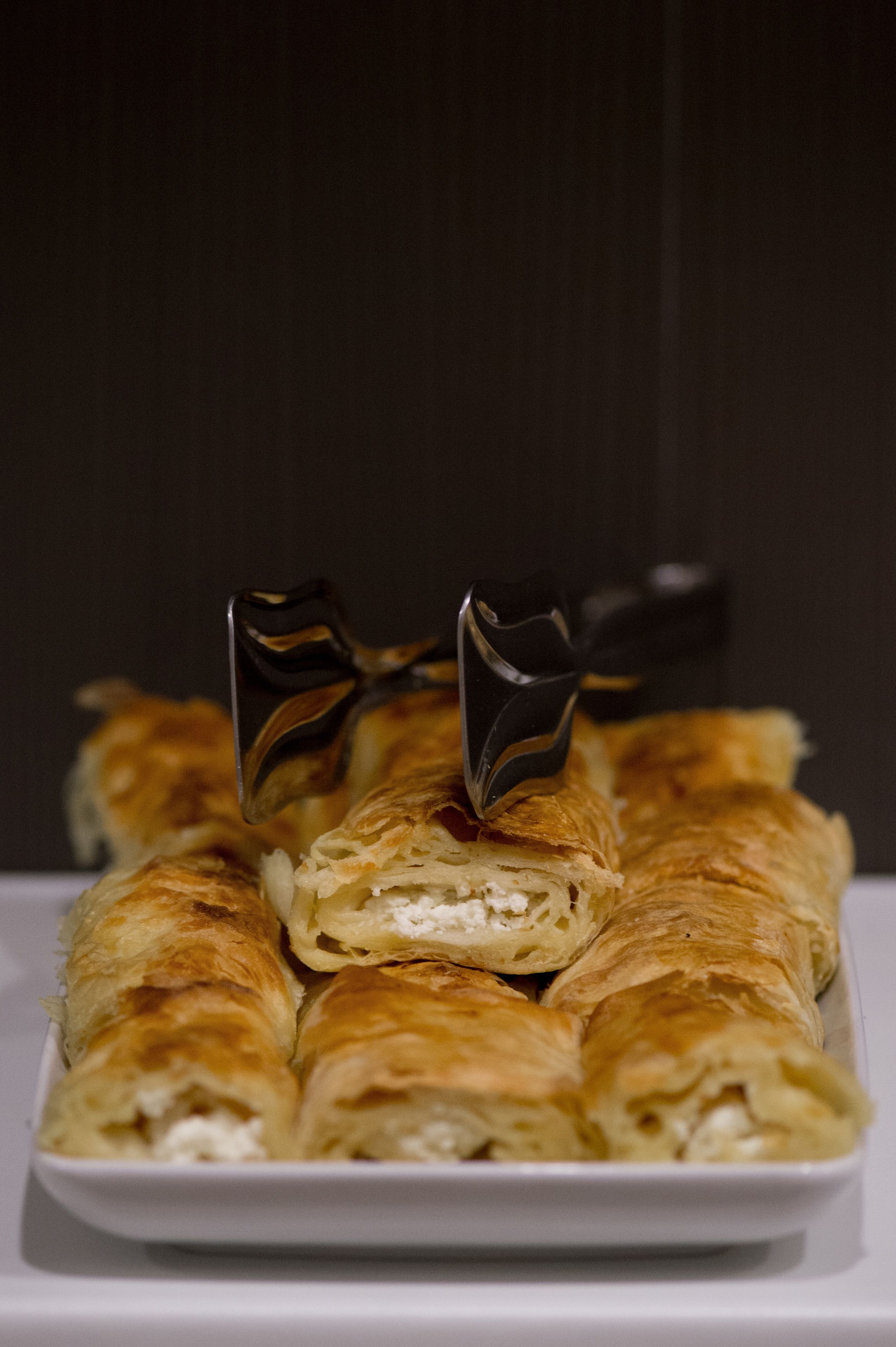 A tray of pastries with a fork.