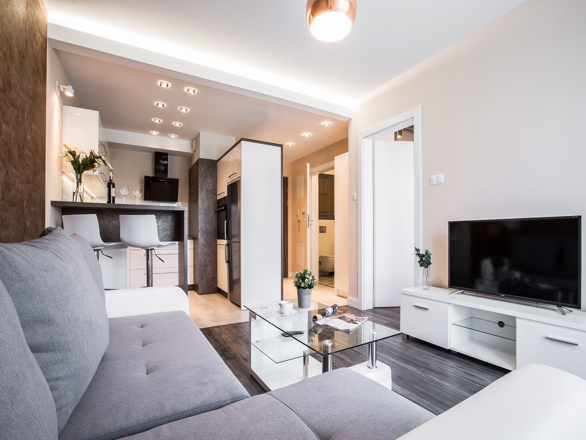 deluxe apartment, 1 bedroom, balcony | living area | 55-inch flat-screen tv with cable channels, tv, netflix