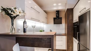 Deluxe Apartment, 1 Bedroom, Balcony | Living area | 55-inch flat-screen TV with digital channels, TV, Netflix