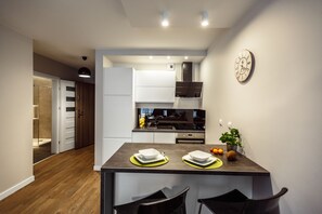Deluxe Apartment, Balcony (2) | Living area | 55-inch flat-screen TV with cable channels, TV, Netflix