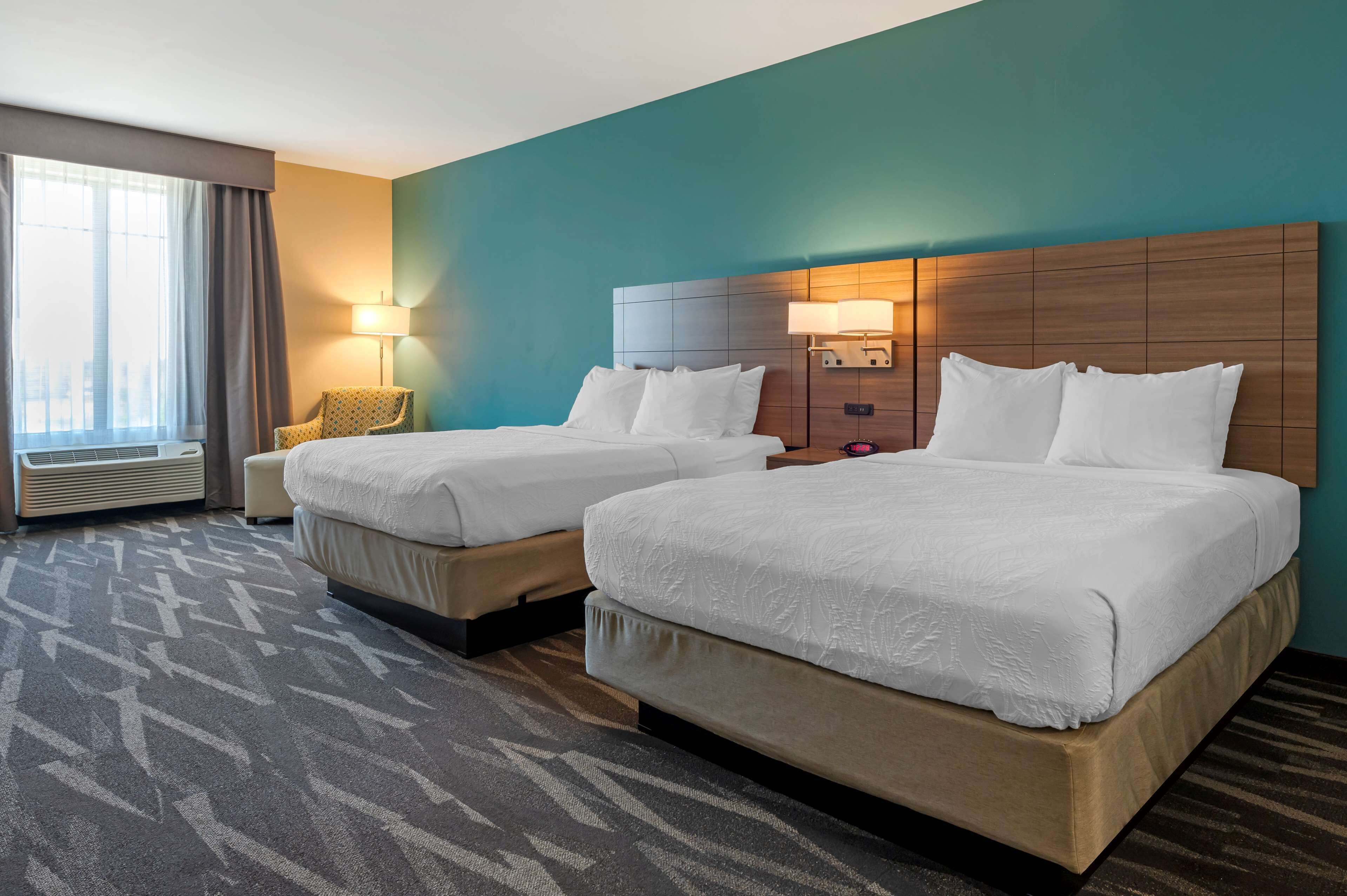 standard room, 2 queen beds, non smoking, refrigerator & microwave | pillow-top beds, in-room safe, individually decorated