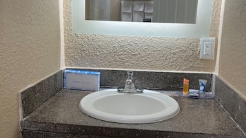 Bathtub, towels, soap, shampoo