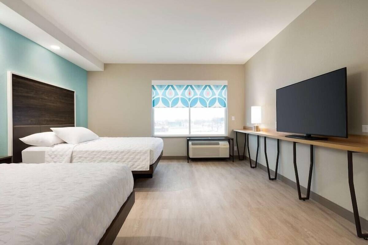 Premium bedding, blackout drapes, iron/ironing board