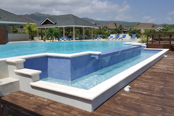 Outdoor pool, pool umbrellas, sun loungers