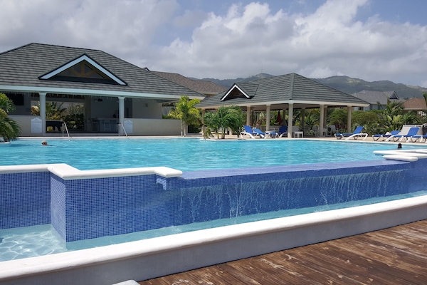 Outdoor pool, pool umbrellas, sun loungers