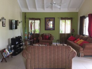 Exclusive Villa, 3 Bedrooms, 2 Bathrooms, Courtyard View | Living room | 50-inch flat-screen TV with cable channels, TV, DVD player - Ocho Rios Villa at the Palms III (St. Ann's Bay)