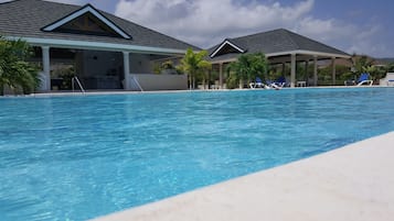 Outdoor pool, pool umbrellas, sun loungers