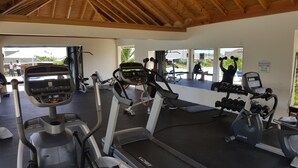 A gym with treadmills, elliptical machines, and weight machines. - Ocho Rios Villa at the Palms V (St. Ann's Bay)