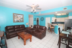 Premium Condo, Multiple Beds, Kitchen, Pool View | Living room | Flat-screen TV