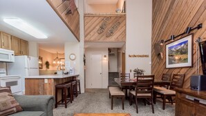 A compact living space with a kitchenette, dining area, and a cozy seating area. - Crestview B46 (Mammoth Lakes)