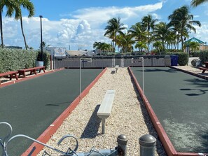 A racetrack with a central gravel path, benches, and a fence. - Dock, Htd 80' Pool, Deep Channel, 15 Min To Key West  (Cudjoe Key)