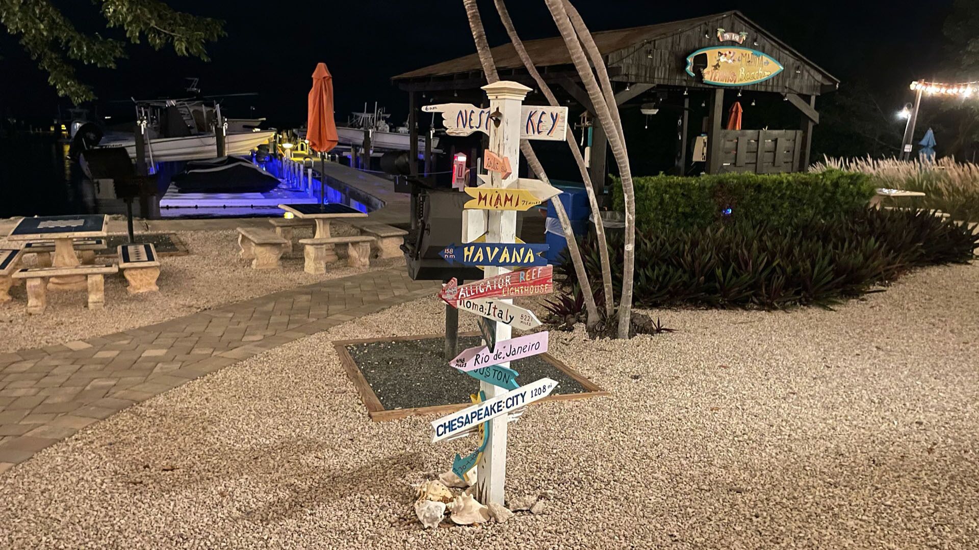 A signpost with multiple directional signs pointing to various destinations.