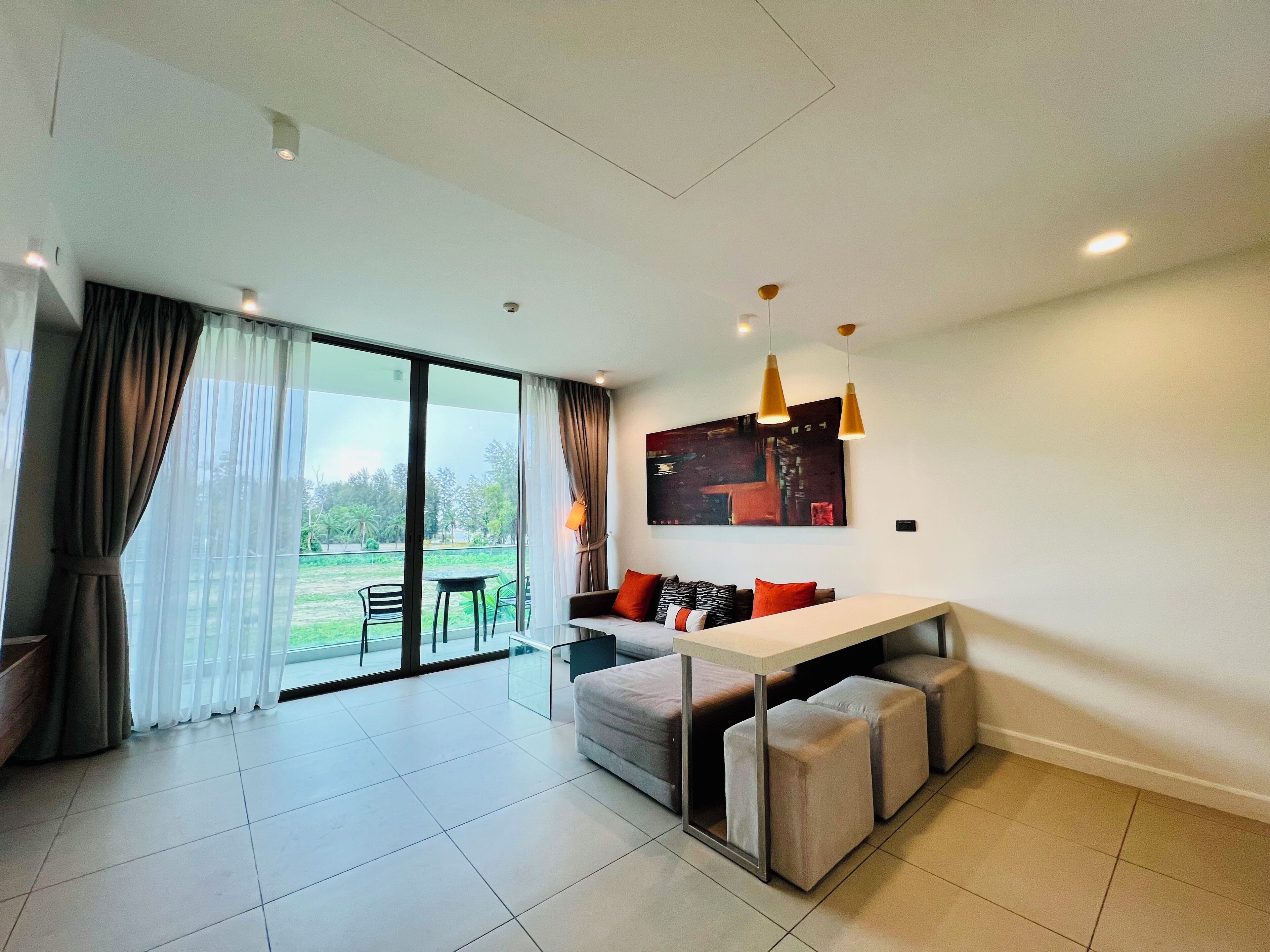 2 bedrooms superior with tropical view | living area | flat-screen tv