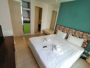 Family Apartment, 1 Bedroom | 1 bedroom, in-room safe, blackout drapes, iron/ironing board - Grande Caribbean Condo by Somphong (Pattaya)