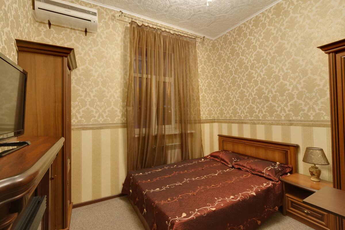 Desk, iron/ironing board, bed sheets