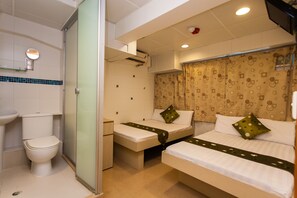A hotel room with a toilet, a shower, two beds, and a bathroom sink. - KG Garden Guest House (Kowloon)