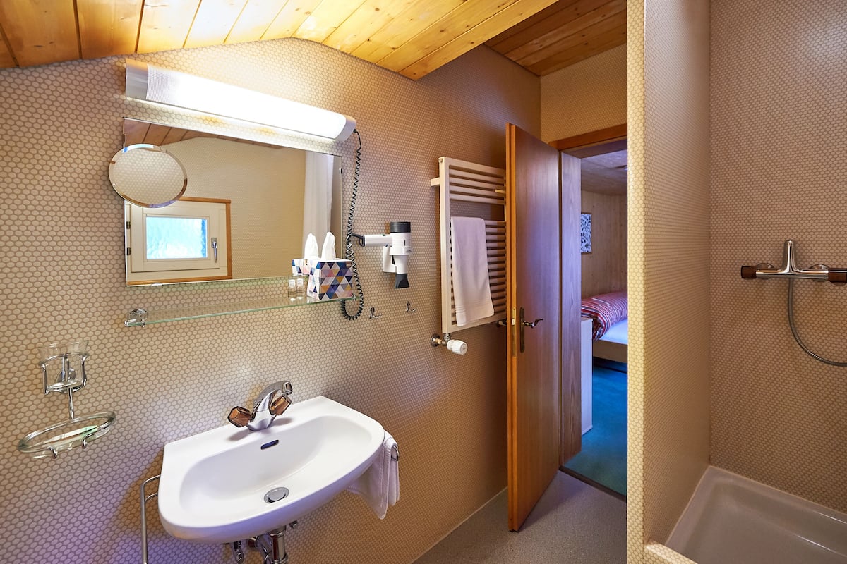 single room, mountain view | bathroom | hair dryer, bathrobes, towels, soap