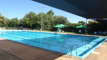 Outdoor pool, pool umbrellas, sun loungers