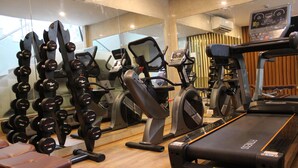 A gym with treadmills, elliptical machines, and free weights. - Keys Lite by Lemon Tree Hotels, Mayfield, Gurgaon (Gurugram)