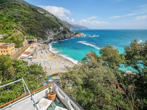 A coastal hotel with a beach view, a pool, and a mountain backdrop. - Villa Tanca with AC, Terrace (Monterosso al Mare)