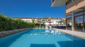 Outdoor pool, open 8:00 AM to 8:00 PM, pool umbrellas, sun loungers