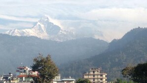 A mountain range with a prominent peak in the background. - Galaxy Inn Guest House (Pokhara)