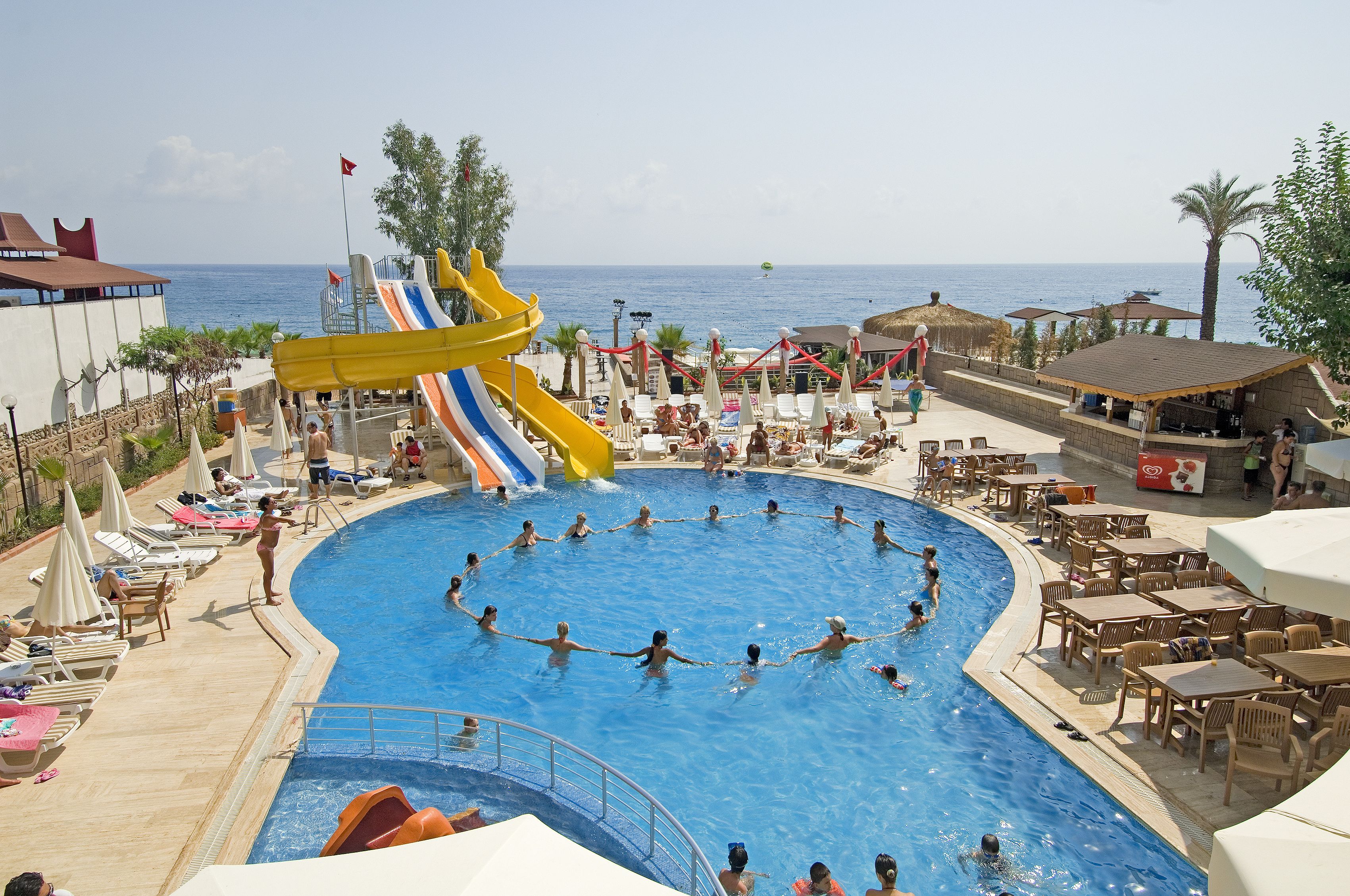 Outdoor pool, a lap pool, pool umbrellas, pool loungers