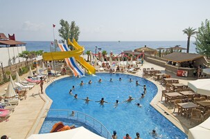 Outdoor pool, a lap pool, pool umbrellas, sun loungers