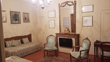 Superior Room, 1 Queen Bed, Kitchenette | Living area | Flat-screen TV