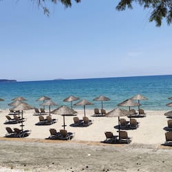 On the beach, sun-loungers, beach umbrellas, beach towels