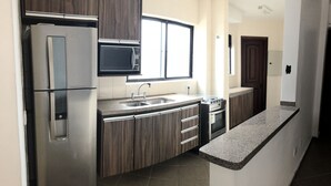 Apartment, 2 Bedrooms | Private kitchen | Coffee/tea maker, fridge, microwave, oven