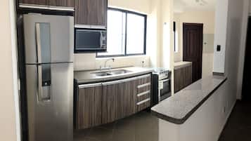 Apartment, 2 Bedrooms | Private kitchen | Fridge, microwave, oven, stovetop
