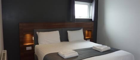 Hypo-allergenic bedding, individually furnished, blackout drapes