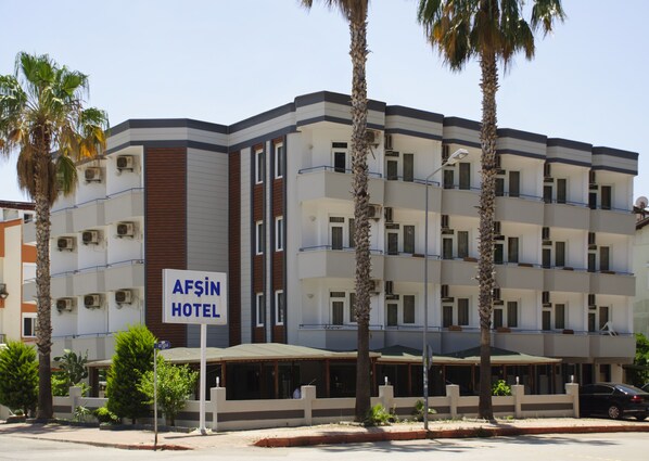 A multi-story hotel with a sign reading "Afsin Hotel". - Afsin Hotel (Konyaalti)