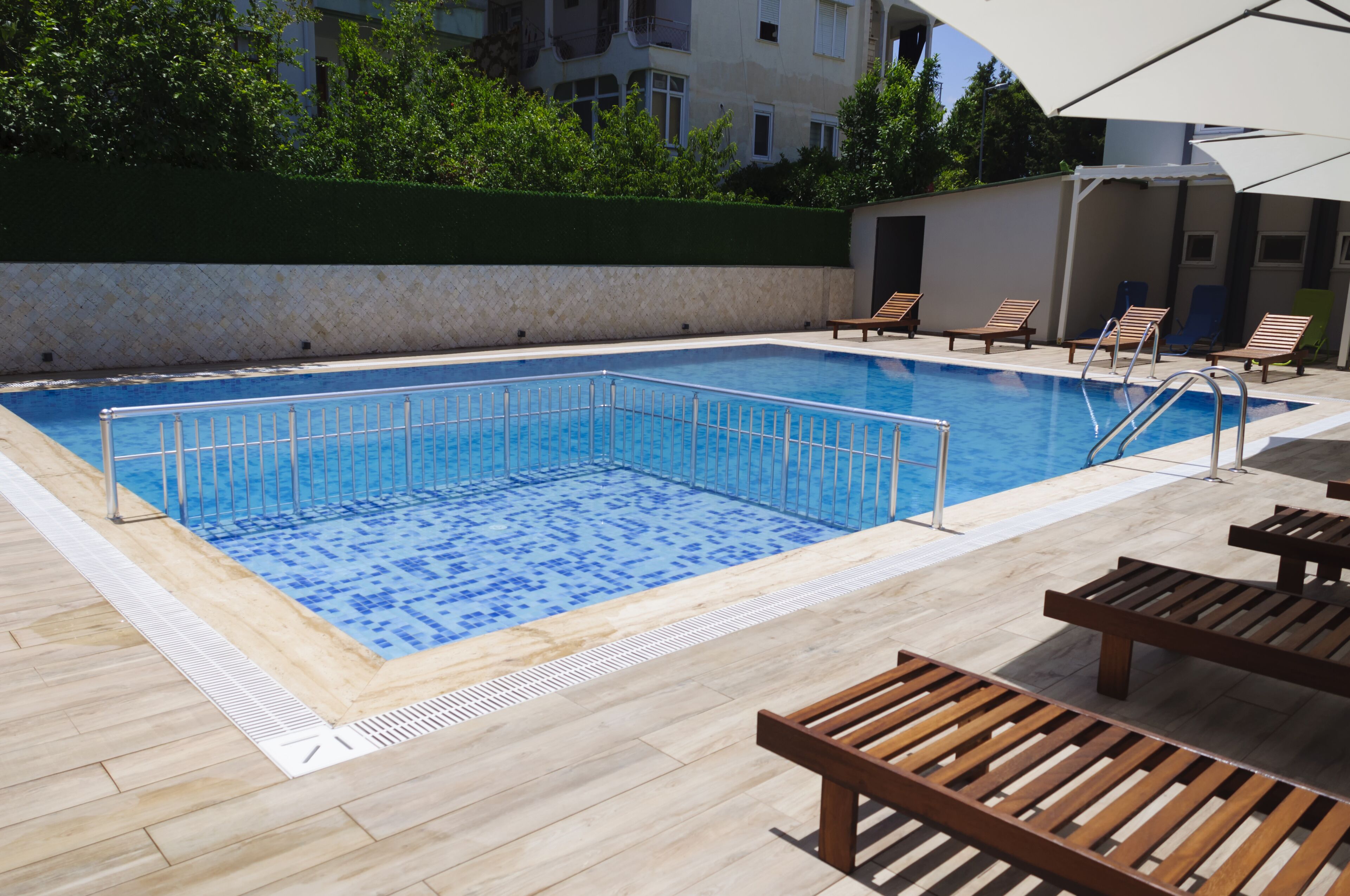 outdoor pool, pool umbrellas, pool loungers