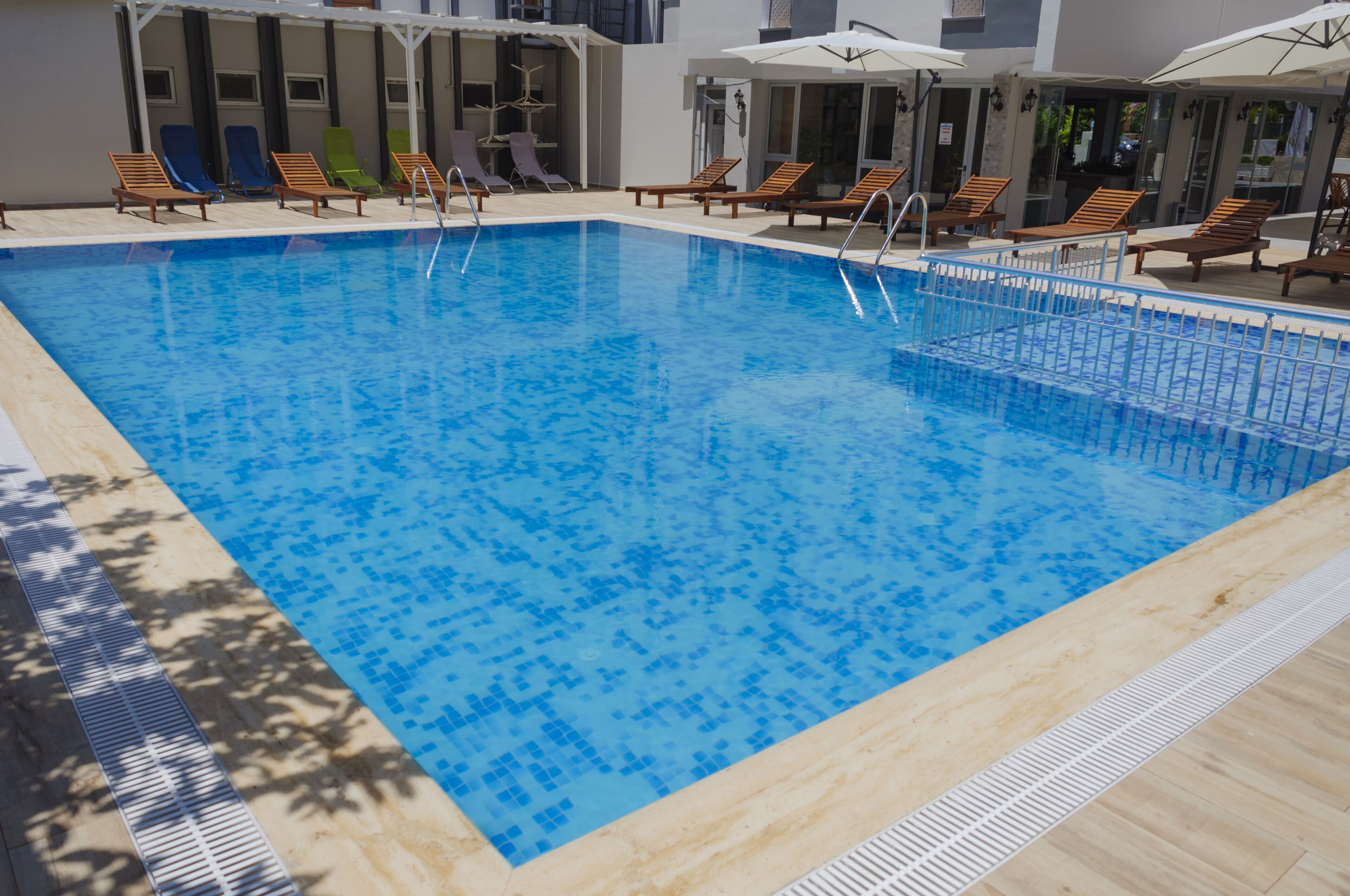 outdoor pool, pool umbrellas, pool loungers