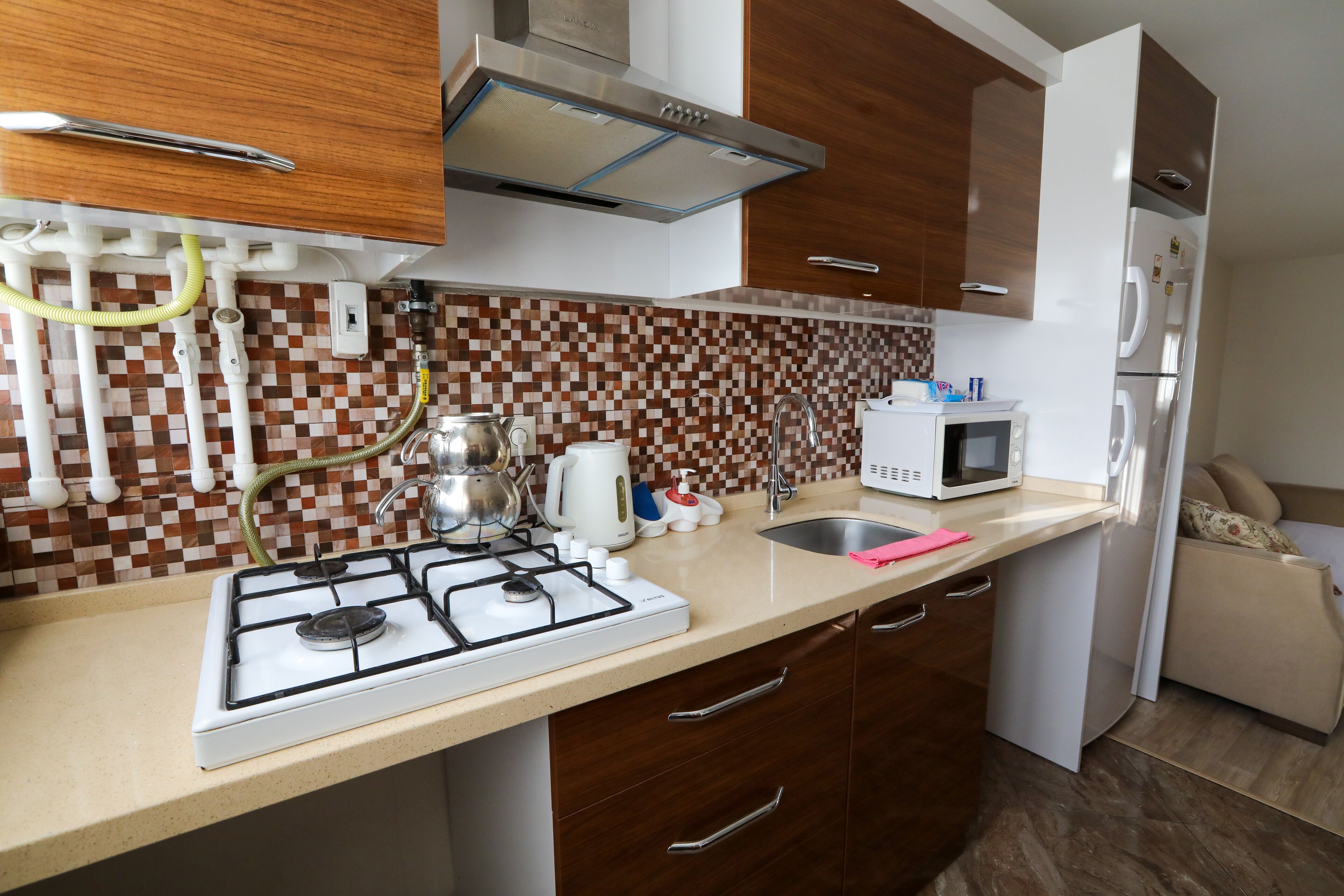 mini-fridge, microwave, stovetop, electric kettle