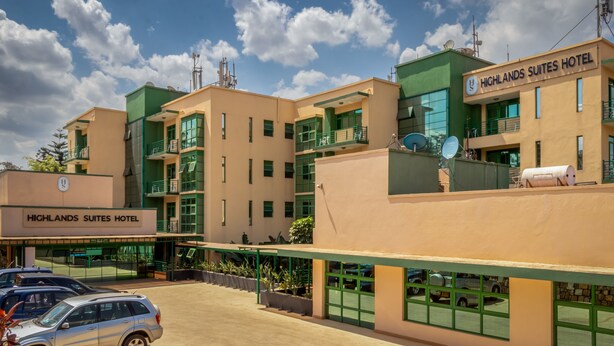 A multi-story hotel with a modern design, featuring balconies and large windows. - Highlands Suites Hotel (Kigali)
